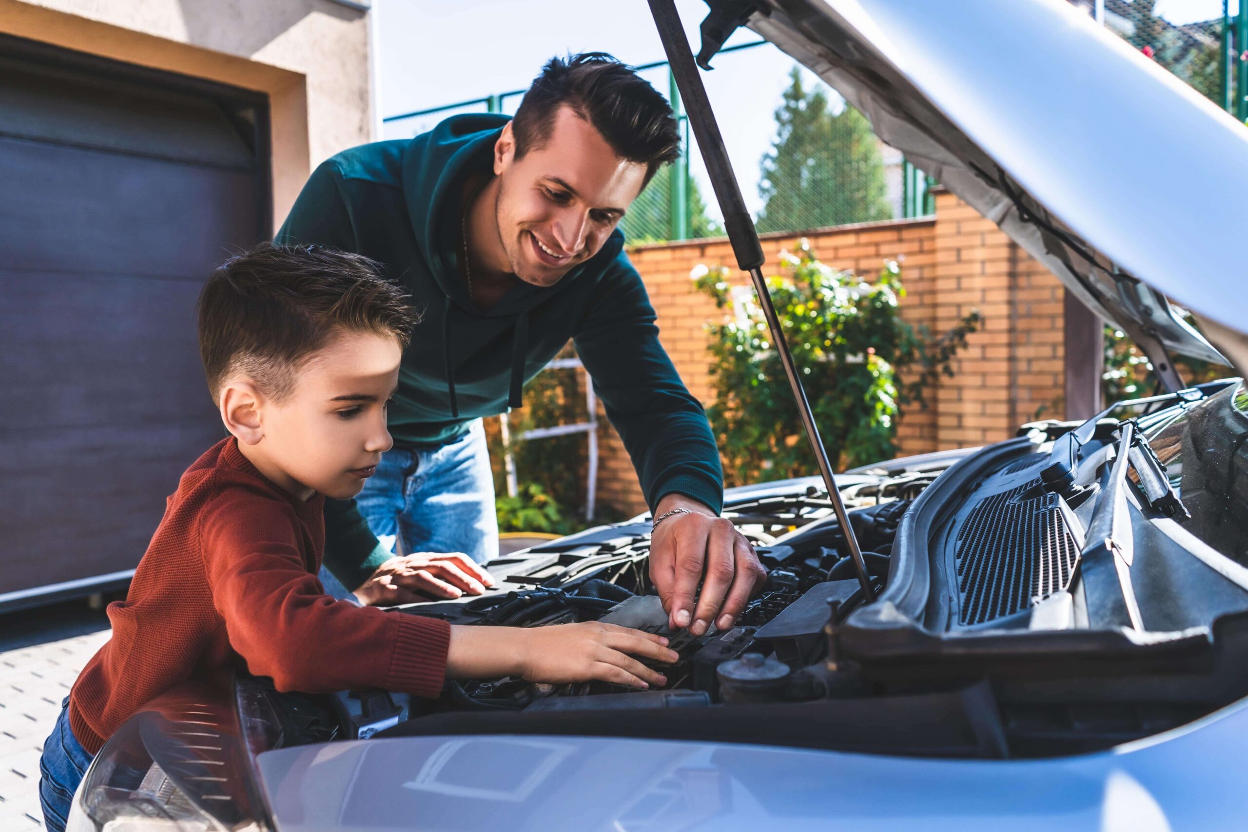 a man instructing a kid about something