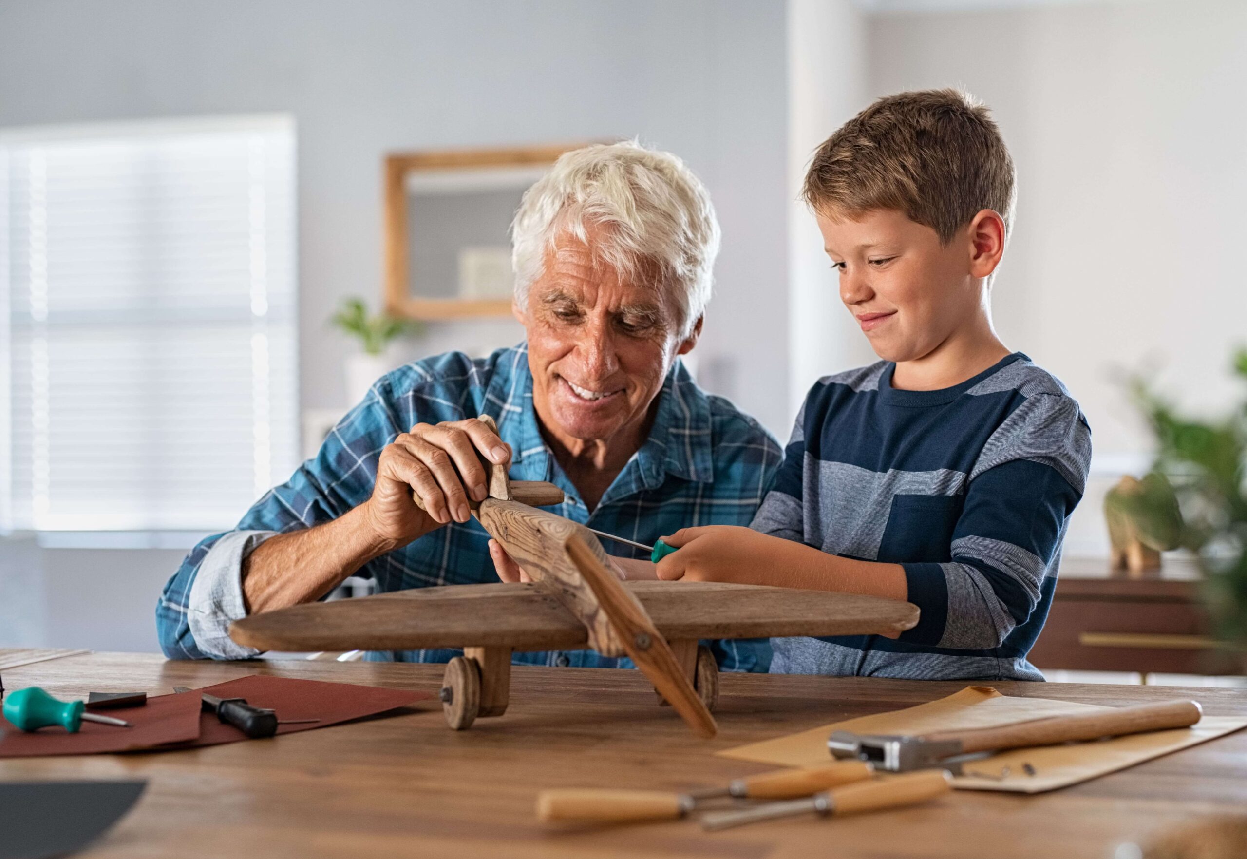 elderly man explaining kid about a task