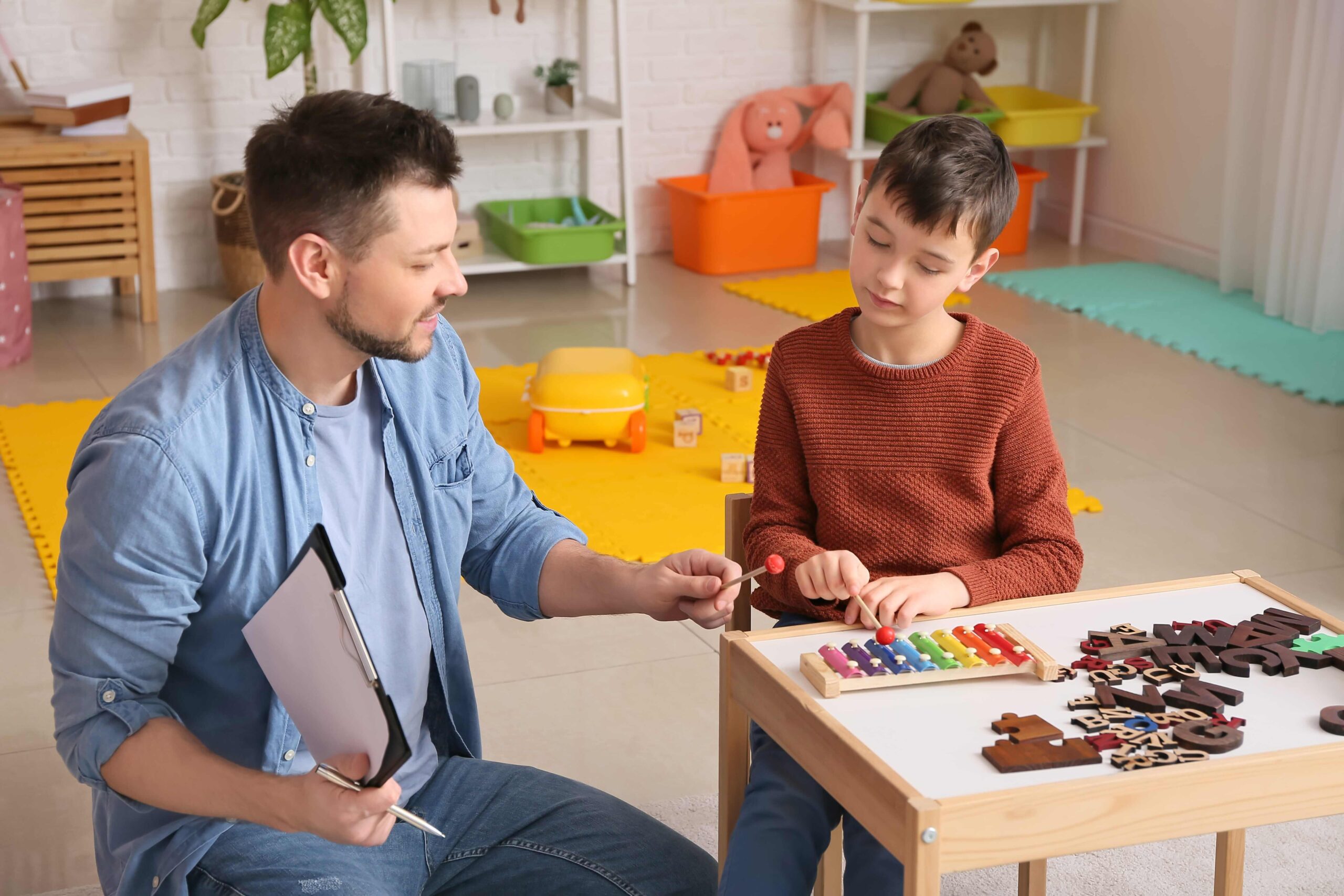 instructor guiding a kid about a specific work